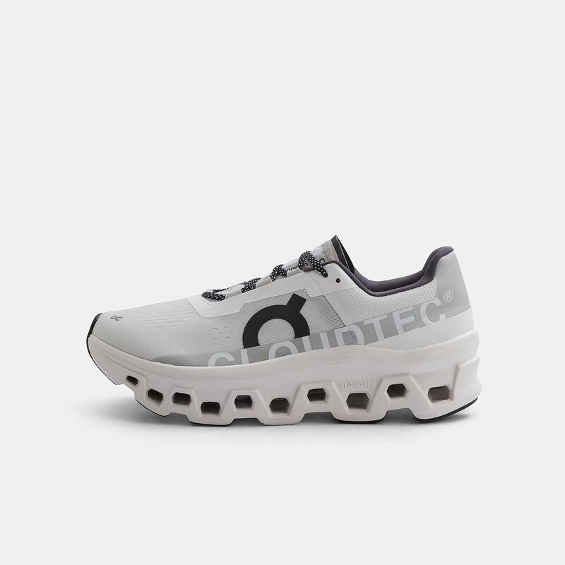 On Cloudmonster, bianco/nero/grigio